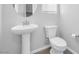 Simple and elegant half bathroom with pedestal sink at 524 Celebratory Pl, Henderson, NV 89011