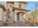 Two-story house with brown roof and desert landscaping at 524 Celebratory Pl, Henderson, NV 89011