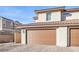 Attached two-car garage with brown doors at 524 Celebratory Pl, Henderson, NV 89011