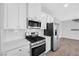 Modern kitchen with stainless steel appliances and white cabinets at 524 Celebratory Pl, Henderson, NV 89011