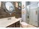 Bathroom with walk-in shower and beach-themed decor at 5916 Magic Oak St, North Las Vegas, NV 89031