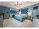 Spacious bedroom with king-size bed and ceiling fan at 5916 Magic Oak St, North Las Vegas, NV 89031