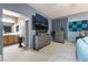 Bedroom with large dresser, TV and view into bathroom at 5916 Magic Oak St, North Las Vegas, NV 89031