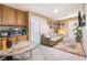 Small sitting area with a couch, round table, and built-in cabinets at 5916 Magic Oak St, North Las Vegas, NV 89031