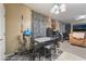 Small dining area with table and chairs, view into living room at 5916 Magic Oak St, North Las Vegas, NV 89031