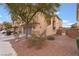 Two-story house with attached garage and gated side yard at 5916 Magic Oak St, North Las Vegas, NV 89031