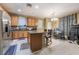 Eat-in kitchen with island, stainless steel appliances, and oak cabinets at 5916 Magic Oak St, North Las Vegas, NV 89031