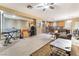 Spacious living room featuring a cozy recliner, coffee table, and a view into the kitchen at 5916 Magic Oak St, North Las Vegas, NV 89031