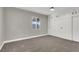 Bright bedroom with white closet doors and carpet flooring at 649 Federal St, Henderson, NV 89015