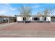 Ranch style home with carport, mature trees, and a well-maintained front yard at 649 Federal St, Henderson, NV 89015