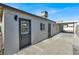 Rear view of the house showing the backyard and access to the back door at 649 Federal St, Henderson, NV 89015