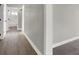 Clean hallway with light gray walls and wood-look flooring at 649 Federal St, Henderson, NV 89015