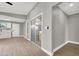 Hallway with gray walls and vinyl plank flooring leading to the backyard at 649 Federal St, Henderson, NV 89015