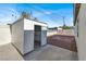 White metal storage shed in the backyard of the property at 649 Federal St, Henderson, NV 89015