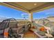 Charming balcony with comfortable seating and a view of the mountains at 7073 Range Valley St, North Las Vegas, NV 89084