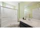 Bright bathroom featuring a walk-in shower, single vanity, and fresh, modern finishes at 7073 Range Valley St, North Las Vegas, NV 89084