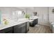 Spacious bathroom featuring double sinks, modern vanities, a soaking tub and glass shower at 7073 Range Valley St, North Las Vegas, NV 89084