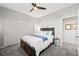 Cozy bedroom with a ceiling fan, closet, and neutral decor at 7073 Range Valley St, North Las Vegas, NV 89084