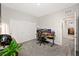 Bedroom with a large workstation, a roomy closet, and natural lighting, perfect for work or study at 7073 Range Valley St, North Las Vegas, NV 89084