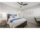 Inviting bedroom with a work desk, ceiling fan, and soft, neutral decor at 7073 Range Valley St, North Las Vegas, NV 89084