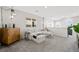 Comfortable upstairs living room with gray carpet, neutral walls, and stylish decor at 7073 Range Valley St, North Las Vegas, NV 89084