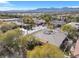 The large backyard of this single-story home is shaded by mature trees in a quiet neighborhood. It has solar panels at 7288 Olsen Farm St, Las Vegas, NV 89131