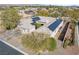 Stunning aerial view of single-story home, highlighting solar panels, desert landscaping, and an enclosed side yard at 7288 Olsen Farm St, Las Vegas, NV 89131