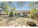 Expansive backyard features desert landscaping and a covered patio at 7288 Olsen Farm St, Las Vegas, NV 89131