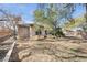 Spacious backyard features desert landscaping and mature trees at 7288 Olsen Farm St, Las Vegas, NV 89131