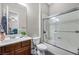 Bathroom with a shower and bathtub combination with a glass shower door, a vanity, and a toilet at 7288 Olsen Farm St, Las Vegas, NV 89131