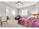 Bedroom with a sitting area, neutral walls, carpet flooring, and a view of the ensuite bathroom at 7288 Olsen Farm St, Las Vegas, NV 89131