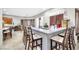 Bright kitchen featuring a granite countertop bar with seating and custom window shutters at 7288 Olsen Farm St, Las Vegas, NV 89131