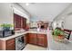 Kitchen with a wine fridge, granite counters, and stainless steel microwave at 7288 Olsen Farm St, Las Vegas, NV 89131