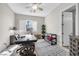 Bright office space with a ceiling fan, plantation shutters, and a decorative rug at 7288 Olsen Farm St, Las Vegas, NV 89131