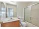 Clean bathroom, featuring a shower/tub combo and wood vanity at 7732 Prosperity River Ave, Las Vegas, NV 89129