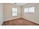 Bright bedroom with neutral walls and carpet flooring at 7732 Prosperity River Ave, Las Vegas, NV 89129