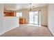 Bright dining room with access to the backyard and kitchen at 7732 Prosperity River Ave, Las Vegas, NV 89129