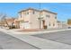 Two-story house showcasing a side view, landscaping, and street view at 7732 Prosperity River Ave, Las Vegas, NV 89129