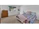 Bright bedroom with a queen-size bed and dresser at 7900 Idledale Ct # 102, Las Vegas, NV 89145