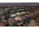 Aerial view of the property highlighting the swimming pool, tennis court, pickleball court, and lush landscaping at 8320 Carmel Ridge Ct, Las Vegas, NV 89113