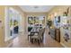 Bright dining room with table and chairs, near pool and golf course views at 8320 Carmel Ridge Ct, Las Vegas, NV 89113