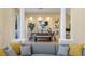 Elegant dining room adjacent to living area, featuring a rustic table and chairs at 8320 Carmel Ridge Ct, Las Vegas, NV 89113