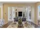 View of the dining area from the living room, showcasing a modern table setting at 8320 Carmel Ridge Ct, Las Vegas, NV 89113