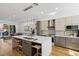 Modern kitchen with a large island, quartz countertops, and stainless steel appliances at 8320 Carmel Ridge Ct, Las Vegas, NV 89113