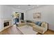 Relaxing living room with a large beige sectional sofa and fireplace at 8320 Carmel Ridge Ct, Las Vegas, NV 89113