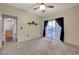 Bright bedroom with ceiling fan and access to a private patio at 8555 W Russell Rd # 1101, Las Vegas, NV 89113