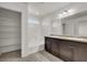 Bathroom features double vanity, tub, and linen closet at 8960 Fox Season Ave, Las Vegas, NV 89178