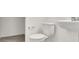 Clean bathroom with pedestal sink and toilet at 8960 Fox Season Ave, Las Vegas, NV 89178