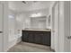 Bathroom boasts double vanity, tub, and tile flooring at 8960 Fox Season Ave, Las Vegas, NV 89178