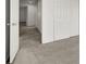 Carpeted hallway with doors to bedrooms and closets at 8960 Fox Season Ave, Las Vegas, NV 89178